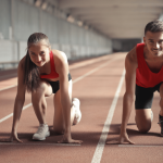 A man and a woman preparing into running posture